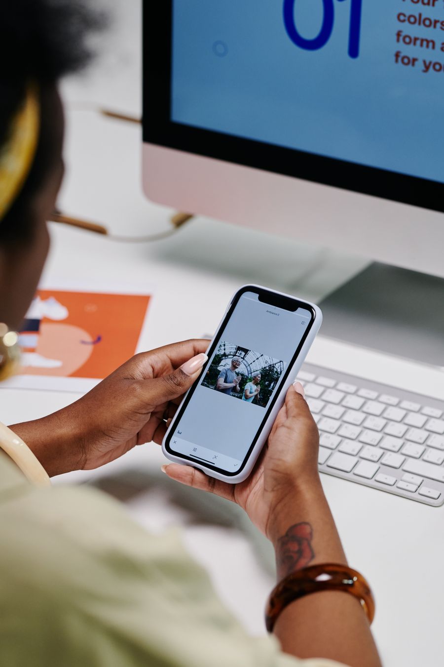Phone showing a social media photo grid